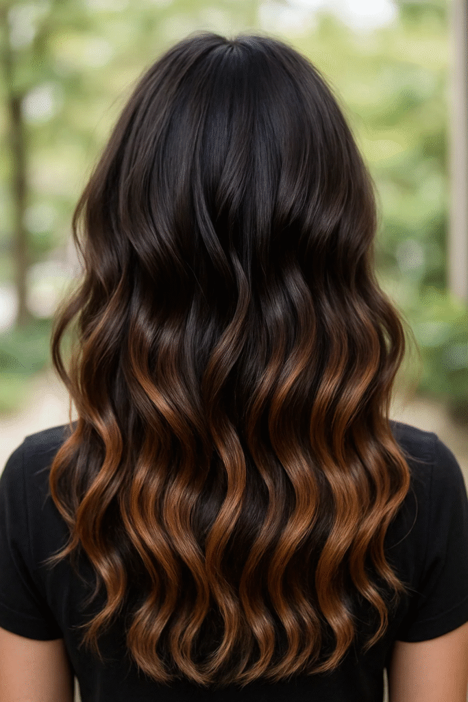 Dark chocolate brown hair with caramel balayage