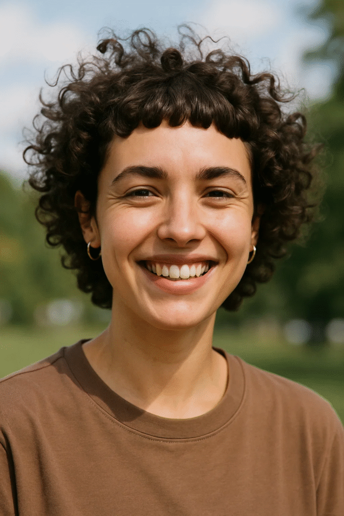 Shoulder length curly hair with curly bangs