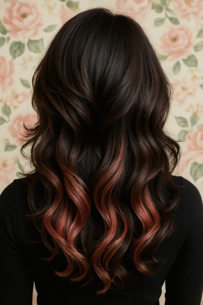 Rose gold peekaboo highlights in layered hair