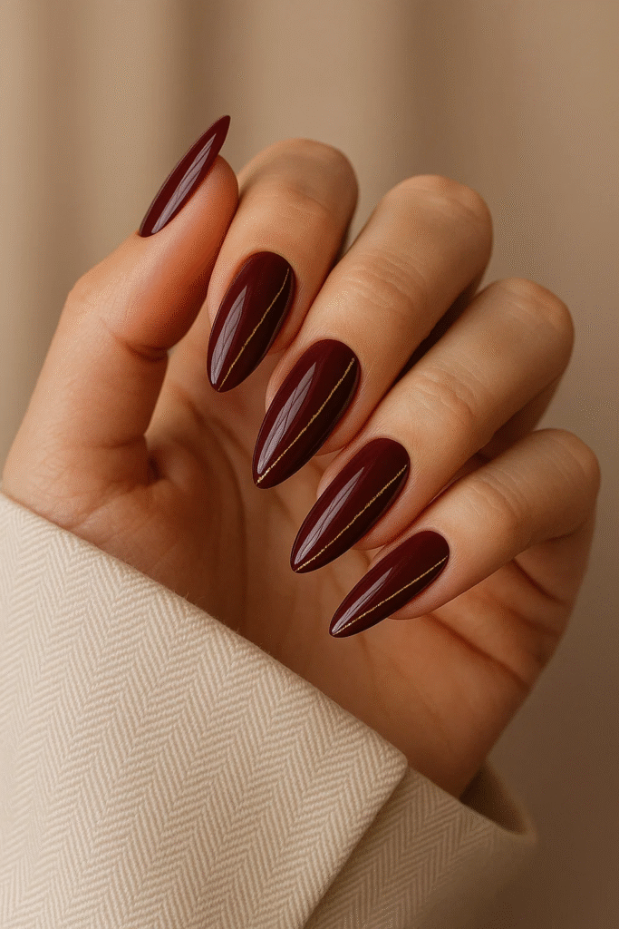 burgundy nails with gold accents 2025 trend