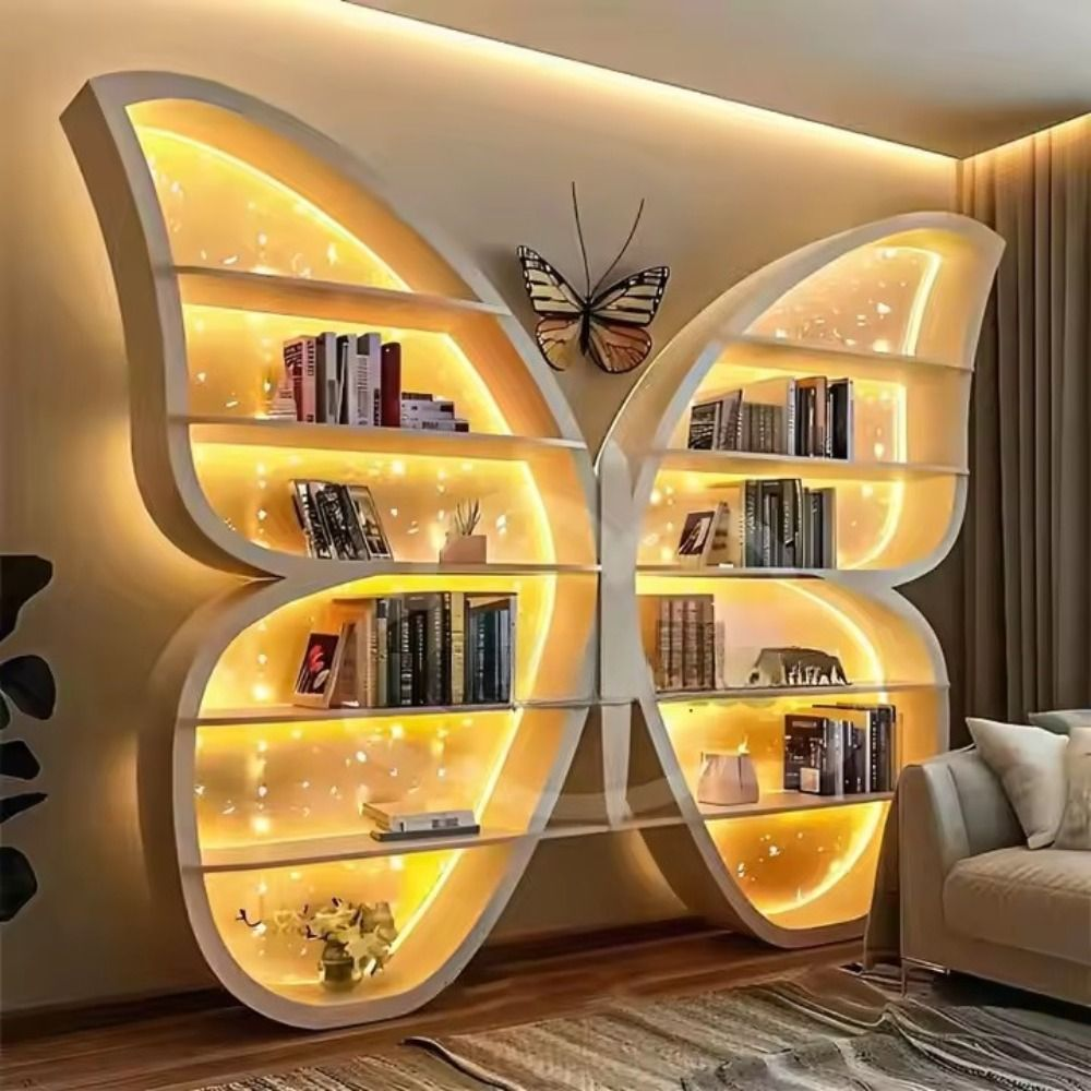 Butterfly-shaped bookshelf with glowing LED lights, used as creative wall decor in a modern living room.