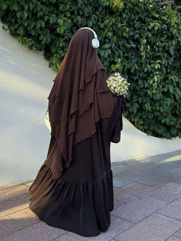 deep brown layered khimar with matching jilbab, modest garden stroll look, bouquet in hand