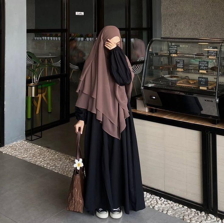 black jilbab outfit with mocha khimar, tote bag and sneakers, modest city coffee shop style