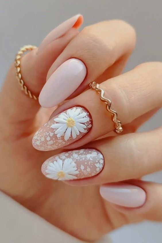 peach French daisy nails on nude base with white half-flowers, glossy almond shape