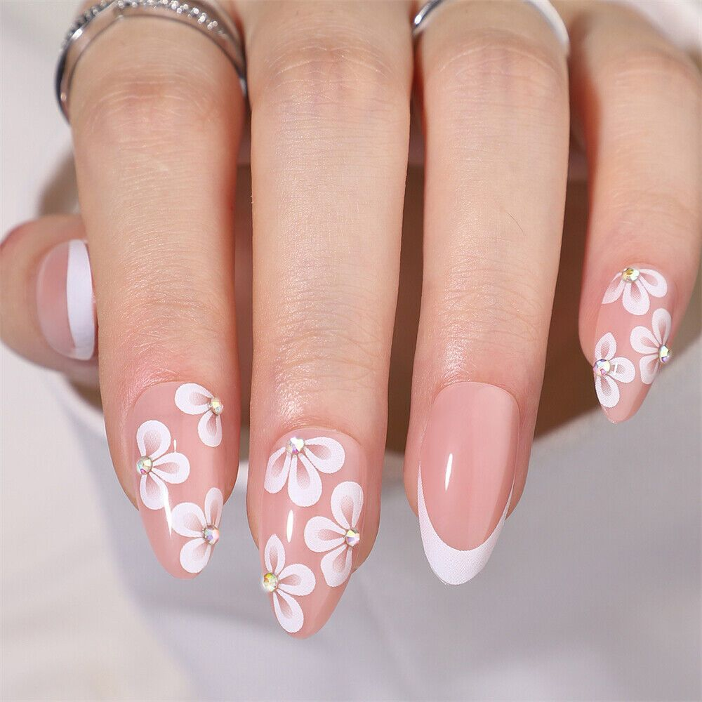 soft pink manicure with delicate flower clusters, minimalist daisy nail art on short nails
