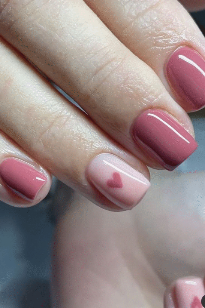 short nails rosy pink with milky accent and tiny heart, glossy short square manicure