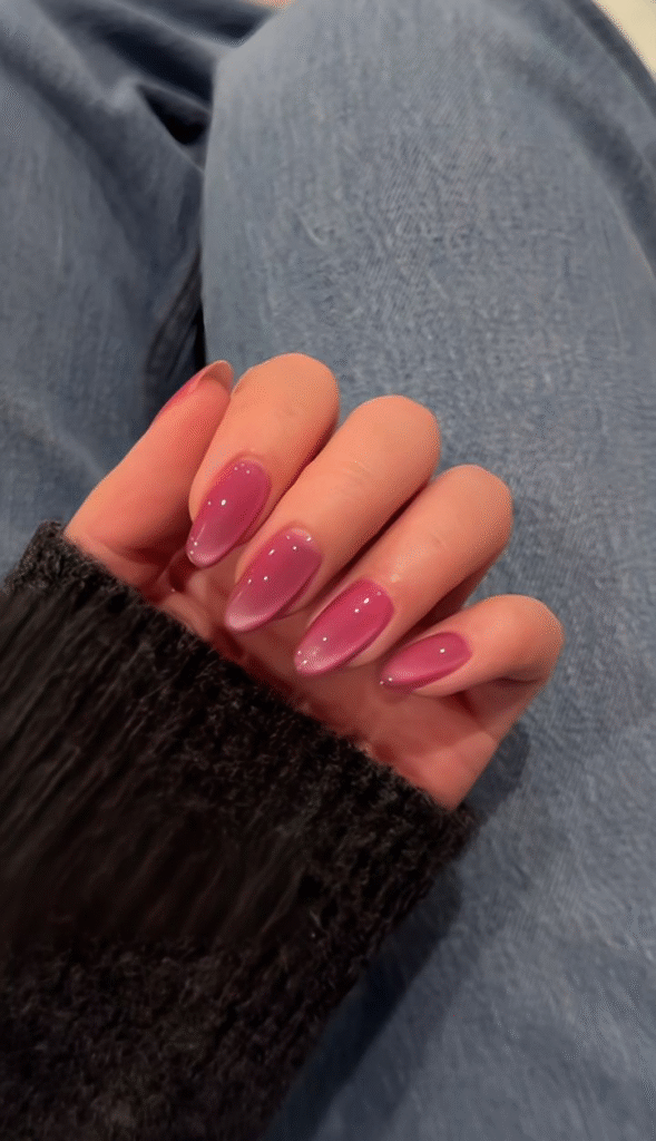 Rosy jelly glaze on almond nails; clean, glassy finish.