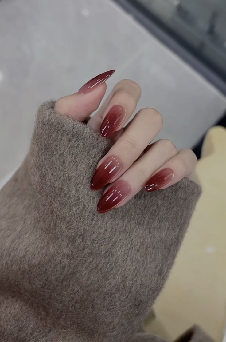 Nude to wine jelly ombré on almond nails with glossy top.