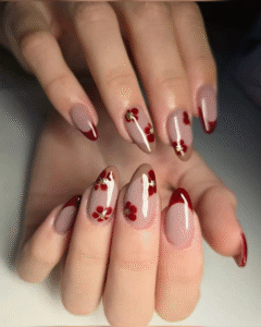 Short almond aesthetic nails with milky nude base, white daisies, and glossy red ladybirds scattered across the set.