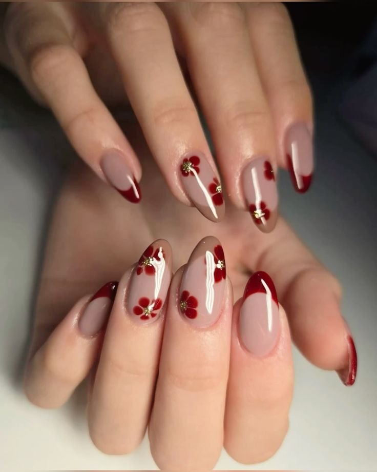 Short almond aesthetic nails with milky nude base, white daisies, and glossy red ladybirds scattered across the set.